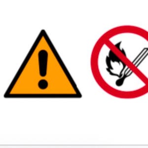 May include: A yellow triangle with a black exclamation point inside, and a red circle with a diagonal line through it. The circle contains a black image of a match with a flame.