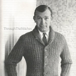 May include: A gray cardigan with a shawl collar, six buttons, and two pockets. The cardigan is knitted in a textured stitch.
