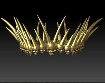 May include: A gold crown with a circle of skulls and sharp spikes. The crown is made of metal and has a detailed design.
