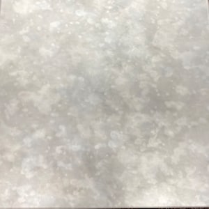 May include: A close-up of a white, textured, rectangular surface with a subtle, mottled pattern. The surface appears to be made of a smooth, reflective material.