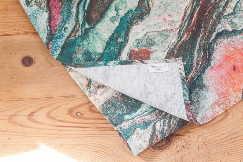 May include: A teal, orange, and white patterned linen table runner with a "Made in Italy" label.