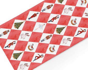May include: Red and white checkered pattern with watercolor illustrations of Christmas trees, ballerinas, toy soldiers, and nutcrackers. The design is festive and suitable for holiday decor.
