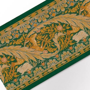 May include: A green fabric with a repeating pattern of stylised deer and floral motifs in gold and cream. The fabric has a textured surface and a border of gold and green.