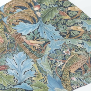 May include: A detailed textile pattern featuring a repeating design of birds, foliage, and flowers. The design includes peacocks, songbirds, and large blue leaves, set against a dark blue background. The color palette includes shades of blue, green, brown, and pink.