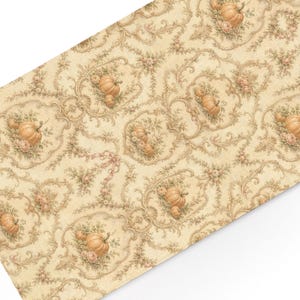 May include: A rectangular fabric piece featuring a cream-colored background with a repeating pattern of orange pumpkins, small pink flowers, and intricate brown scrollwork designs arranged in ornate, interconnected oval frames across the surface.