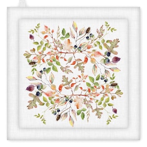 May include: A square white pot holder with a watercolor design of autumn leaves, berries, and seed pods. The leaves are in shades of green, orange, and brown, with small blue berries. The pot holder has a loop for hanging.