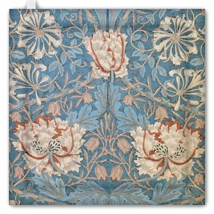May include: A square floral pattern in blue, cream, and rust. The design features large, stylized flowers and leaves with intricate details, creating a vintage aesthetic. The background is a solid, medium blue.