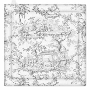 May include: Square, white pot holder with a black and white toile pattern. The design features a detailed pastoral scene with figures, trees, and architectural elements. The pot holder has a loop for hanging.