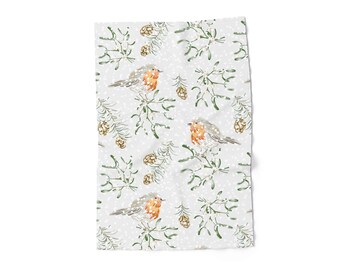 May include: A light gray textile featuring a repeating pattern of robins, mistletoe, pinecones, and snowflakes. The robins have orange breasts and gray wings. The mistletoe and pine needles are green, and the pinecones are brown.