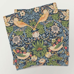 May include: Set of three blue napkins with a floral pattern featuring birds and berries. The pattern is reminiscent of William Morris's designs.