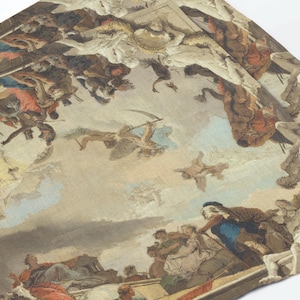 May include: A rectangular fabric textile featuring a detailed printed reproduction of a classical oil painting. The scene depicts numerous figures in dynamic poses amidst clouds and architectural elements, rendered in muted tones of beige, blue, and red.