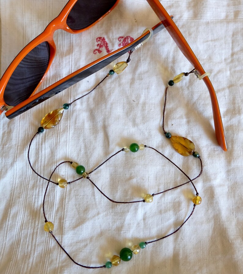 Bezel strap in amber and fine stones Bezel strap in amber and fine stones
