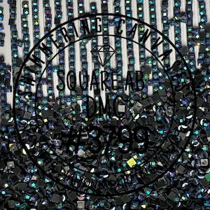 May include: Close-up of iridescent black square beads with the text "SWIMMERING CANVAS SQUARE AB DMC #3799" in a circle.