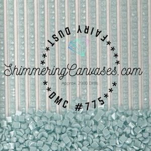 May include: A close-up of light blue diamond-shaped rhinestones, with the text "***FAIRY DUST*** Shimmering Canvases.com Approx. 2900 Drills * **DMC #775**" above.