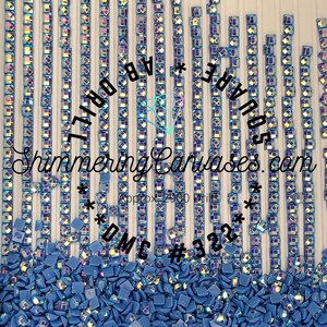 May include: A close-up of a blue square diamond mosaic with approximately 2900 drills. The mosaic is arranged in rows and columns, and the individual squares are iridescent. The text "SQUARE AB" and "DMC # 322" are visible in the image. The text "Shimmering Canvases.com" is also visible in the image.