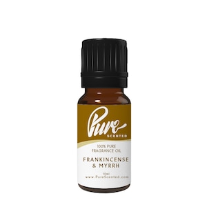 May include: A 10 ml amber glass bottle of Pure Scented Frankincense & Myrrh fragrance oil. The bottle has a black cap and a white label with the brand name and product information.