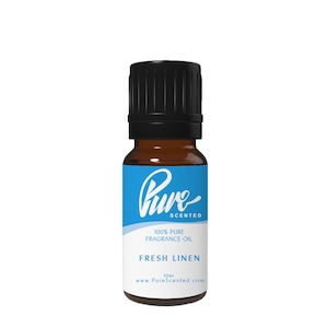May include: A 10 ml bottle of Pure Scented Fresh Linen fragrance oil. The bottle is amber glass with a black cap and a blue label with white text.