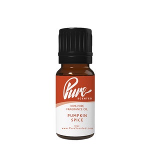 May include: A 10 ml bottle of Pure Scented Pumpkin Spice fragrance oil. The bottle is amber glass with a black cap and a white label with the brand name and product information.