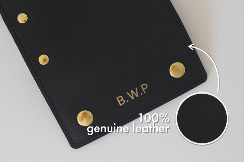 May include: Black leather wallet with gold rivets and the text "B.W.P. 100% genuine leather" embossed on the front.