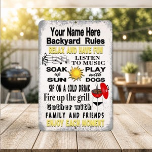 May include: A rectangular metal sign with the text "Your Name Here Backyard Rules" in black and yellow. The sign lists backyard activities like relaxing, listening to music, and grilling. A red and black grill graphic is included.