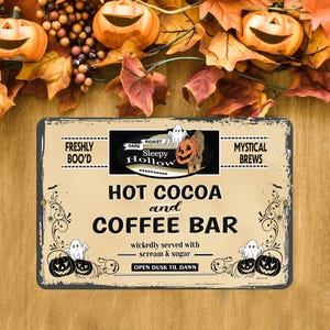 May include: A rectangular metal sign with a beige background featuring black text that reads: Freshly Boo'd, Mystical Brews, Sleepy Hollow Dark Roast, Hot Cocoa and Coffee Bar, wickedly served with scream & sugar, and Open Dusk Til Dawn, with pumpkin graphics.