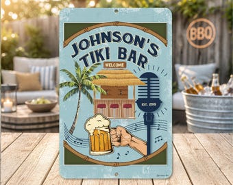 May include: A vintage-style metal sign for "Johnson's Tiki Bar" with a light blue background. The sign features a palm tree, a tiki bar illustration, a hand holding a beer, and musical notes. The sign also includes the text "Welcome" and "Est. 2019".