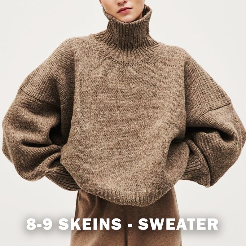 May include: A brown turtleneck sweater with a loose fit and long sleeves. The sweater is made of a chunky knit and has a relaxed, oversized look. The text "8-9 SKEINS - SWEATER" is printed at the bottom of the image.