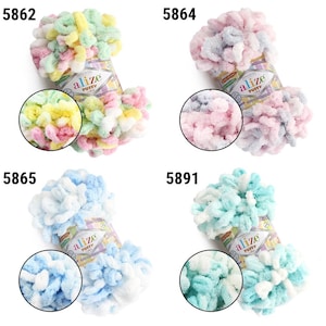 May include: Four colorful skeins of Alize Puffy yarn in various pastel shades. The yarn is a looped chenille style, with colors including pink, blue, green, yellow, and white. Each skein has a label with the brand name and product information.