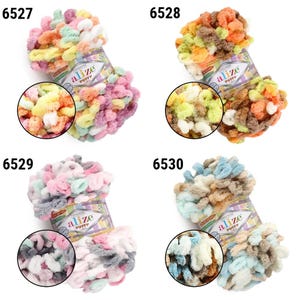 May include: Four colorful Alize Puffy yarn skeins. Each skein is a different color combination, including pink, yellow, orange, and blue. The yarn is soft and fluffy, perfect for knitting or crocheting. Each skein has a circular close-up of the yarn.