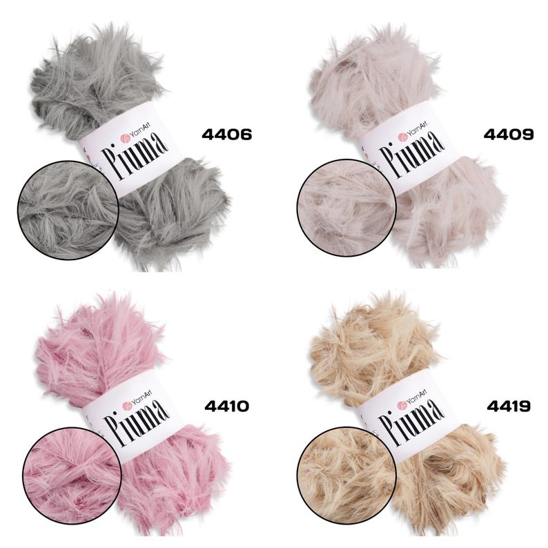 May include: Four skeins of YarnArt Piuma yarn in various colors: gray (4406), light beige (4409), pink (4410), and tan (4419). Each skein has a fluffy, feather-like texture and a label with the brand name and color number. Ideal for knitting and crochet projects.
