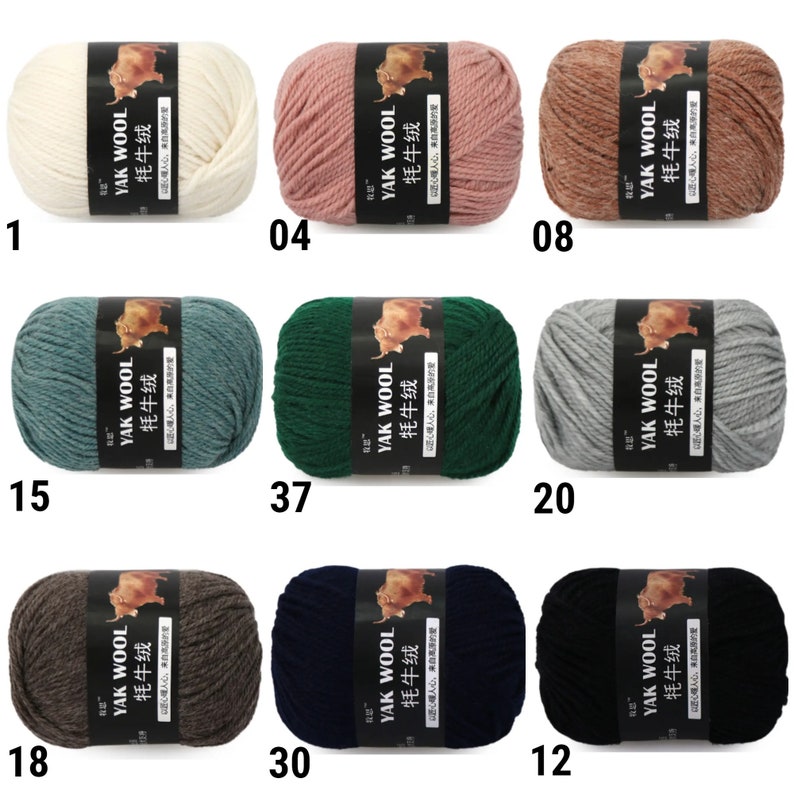 May include: Ten skeins of yarn in various colors, including white, pink, brown, green, blue, gray, and black. Each skein has a label that reads "YAK WOOL 牦牛绒" in black text on a white background.