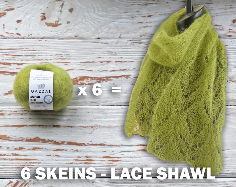 May include: A green lace shawl made with six skeins of Gazzal Super Kid Mohair yarn. The yarn label is visible in the image. The text on the label reads "Gazzal Super Kid Mohair".