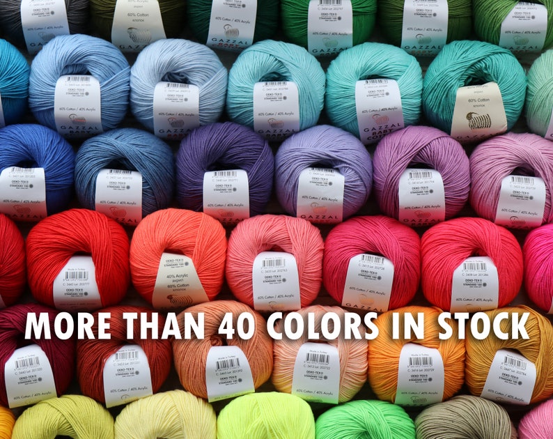 May include: A collection of yarn skeins in various colors, including blue, green, purple, red, and orange. Each skein has a label. The text "MORE THAN 40 COLORS IN STOCK" is displayed across the bottom of the image.
