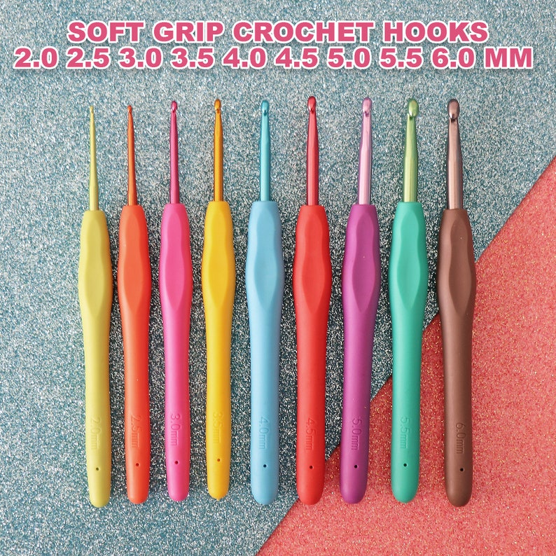 May include: Set of nine colourful crochet hooks with soft grips. The hooks are arranged in order of size, from 2.0 mm to 6.0 mm. The hooks are made of metal and have a plastic handle.