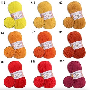 May include: A collection of Alize brand yarn skeins in various colors, including yellow, orange, red, and burgundy. Each skein is accompanied by a small swatch of the same color, showcasing the yarn's texture. The image is well-lit, highlighting the vibrant hues.