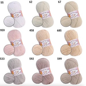 May include: A collection of Alize Cotton Gold yarn skeins in various colors, including white, beige, pink, and gray. Each skein has a close-up view of the yarn texture and the Alize Cotton Gold label. The numbers 55, 62, 67, 959, 458, 685, 533, 592, and 599 are visible.