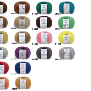 May include: Assortment of 18 skeins of yarn in various colors, including brown, green, yellow, pink, gray, red, orange, and purple. Each skein is labeled "GAZZAL SUPER KID"