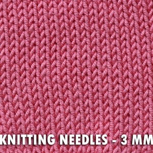 May include: Close-up of a knitted fabric in a vibrant pink hue. The texture reveals a detailed pattern of vertical stitches. The text "KNITTING NEEDLES - 3 MM" is displayed at the bottom of the image, indicating the needle size.
