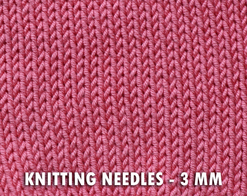 May include: Close-up of a knitted fabric in a vibrant pink hue. The texture reveals a detailed pattern of vertical stitches. The text "KNITTING NEEDLES - 3 MM" is displayed at the bottom of the image, indicating the needle size.