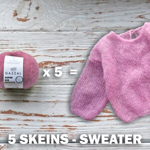 May include: Five skeins of pink Gazal Super Kid Mohair yarn are needed to knit a pink sweater. The yarn is shown next to the finished sweater.