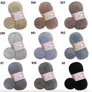 May include: A collection of Alize Cotton Gold yarn skeins in various colors, including beige, brown, gray, and blue. Each skein is labeled with a color code and a close-up of the yarn texture. Ideal for knitting and crochet projects.