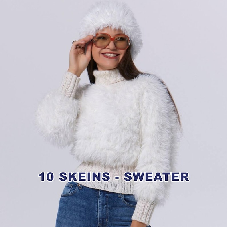 May include: A woman wearing a fluffy white sweater with a turtleneck and matching hat. The sweater has long, voluminous sleeves. The text "10 SKEINS - SWEATER" is displayed at the bottom of the image. She is wearing orange-tinted sunglasses.