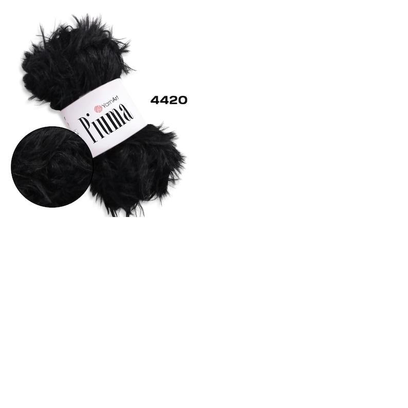 May include: A skein of black YarnArt Piuma yarn with a close-up detail. The yarn is fluffy and textured, with a label that reads "Piuma" and the number "4420". The yarn is ideal for knitting and crochet projects.