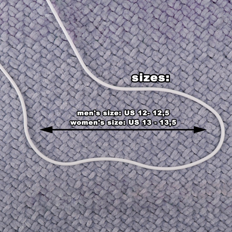 May include: A white outline of a foot with the text "sizes: men's size: US 12 - 12,5 women's size: US 13 - 13,5" on a gray textured background.