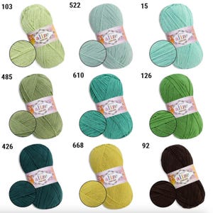 May include: A collection of Alize Cotton Gold yarn skeins in various colors, including shades of green, teal, yellow, and brown. Each skein has a matching swatch, and the product labels display the Alize brand name and product details.