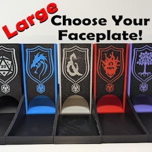 May include: Five different colored dice towers with various faceplates. The faceplates feature a dragon, a tree, a symbol, an eye, and a skull. The text "Choose Your Faceplate!" is displayed above the towers.