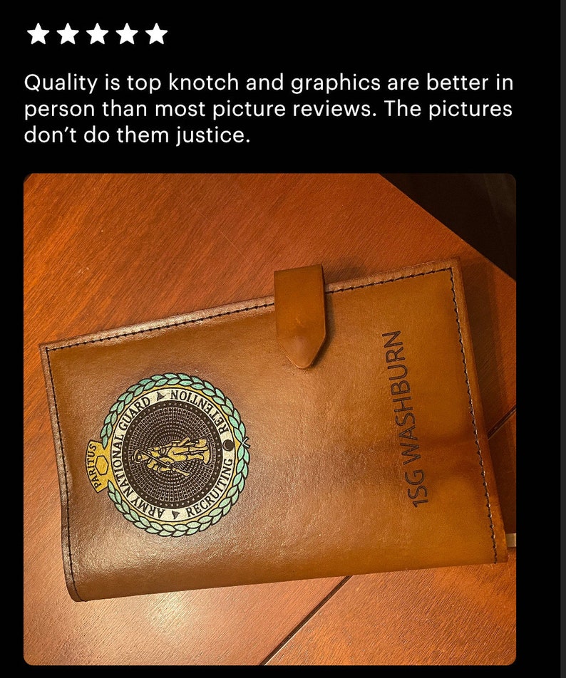May include: A brown leather journal with a gold embossed Army National Guard logo and the text "1SG WASHBURN".