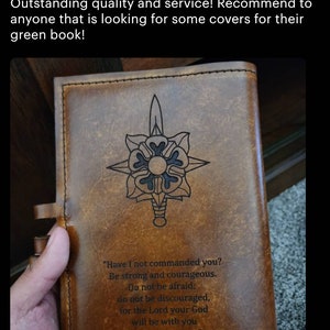 May include: A brown leather journal with a decorative design of a sword and a flower. The journal has a quote on the front that reads "Have I not commanded you? Be strong and courageous. Do not be afraid; do not be discouraged, for the Lord your God will be with you wherever you go."