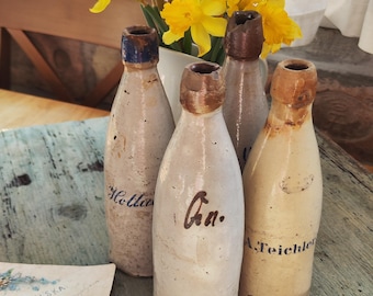 Antique stoneware bottles of beer, german salt glazed stoneware beer bottles