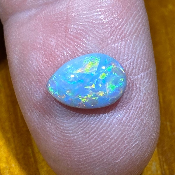 Bright multicoloured 1.7 Carat Lightning Ridge Opal #409 measuring 11.2 x 7.6 x 3 mm
